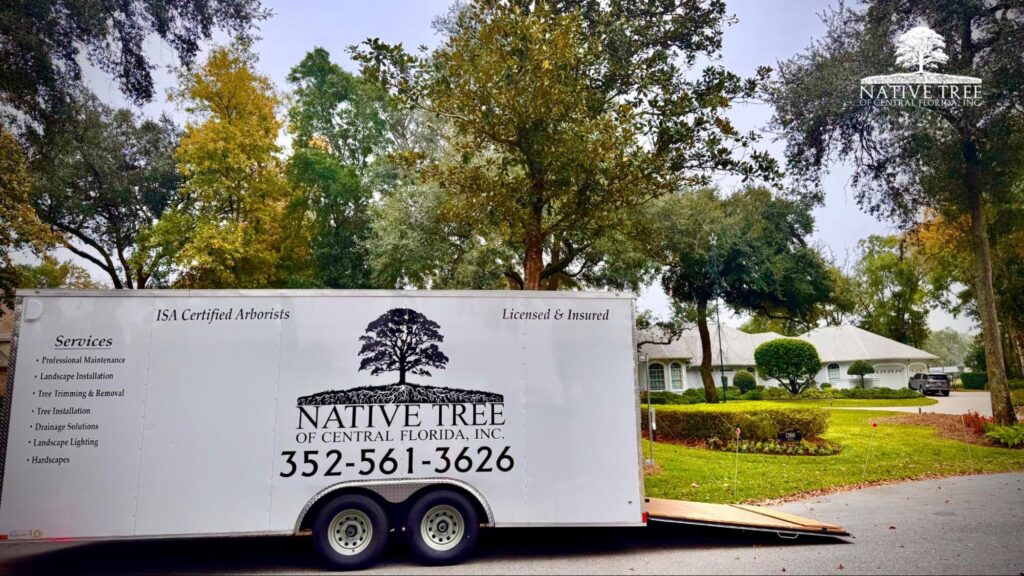 A white trailer featuring the Native Tree Services logo, promoting trust among Central Florida homeowners.